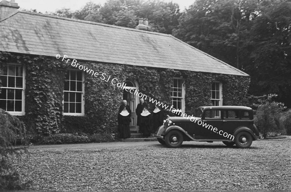 MERCY CONVENT WITH NUNS AT DOOR AND CAR